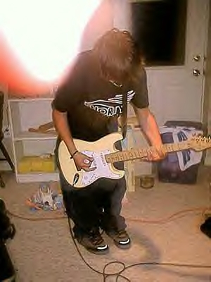 johnplayingguitar..jpg